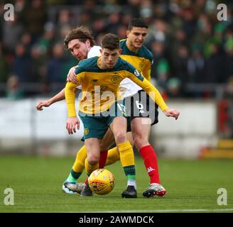 9th February 2020; Broadwood Stadium, Cumbernauld, North Lanarkshire, Scotland; Scottish Cup Football, Clyde versus Celtic; Raymond Grant of Clyde and Ryan Christie of Celtic challenge for the ball Stock Photo