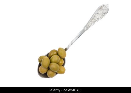 Vintage spoon with green olives isolated on white background with clipping path Stock Photo
