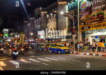 PATTAYA, THAILAND – DEC. 21, 2018: Traffic and crowd walking through the famous night life tourist attraction Walking Street in Pattaya,Thailand. Stock Photo