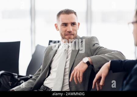 happy businessman discussing with colleague new business plan Stock Photo