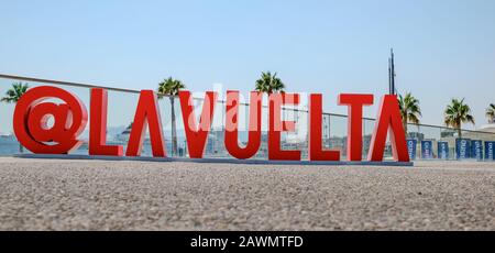 Malaga, Spain - August 25, 2018. Malaga, Spain - August 27, 2018. la vuelta logo letters from plastic attached to the pavement at Muelle Uno in the po Stock Photo