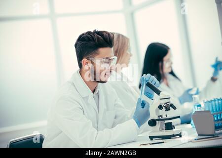group of laboratory technicians checking tests for coronavirus Stock Photo