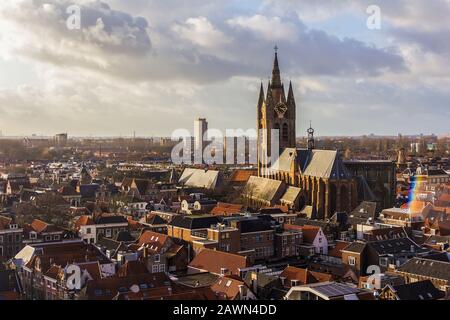 Delft, the Netherlands, Holland,January 18, 2020. Top view from the New Church (Nieuwe Kerk) Bell Tower of  the leaning bell tower of the Old church Stock Photo