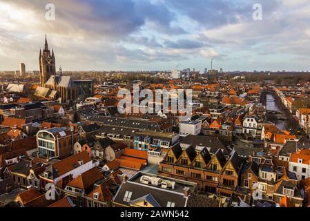 Delft, the Netherlands, Holland,January 18, 2020. Top view from the New Church (Nieuwe Kerk) Bell Tower of  the leaning bell tower of the Old church Stock Photo