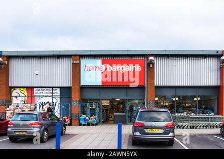 Front of a Home Bargains discount shop with shopping trolleys and racks of goods  in Trowbridge Wiltshire Stock Photo