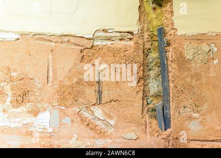 electric wires in a wall during renovation in england uk. Stock Photo