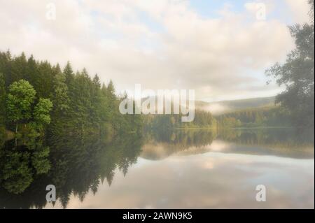 Lake surrounded by mountains,Harz,Germany. Stock Photo