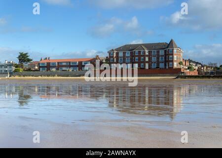 South Parade buildings reflected on the beach, West Kirby Stock Photo