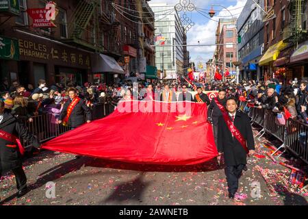 People carry a giant dragon during the Lunar New Year of the Snake