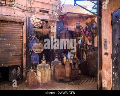 Entrance to an old store in Marrakech decorated with traditional lamps in various forms and colors Stock Photo