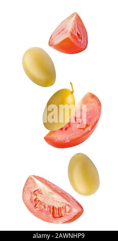 Isolated cut tomato and olives in the air for salads Stock Photo