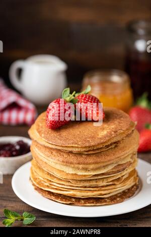 Thin pancakes or crepes or blini. Tasty sweet breakfast food. Rustic background Stock Photo