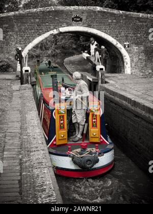 Historic narrowboat exiting Tixall Lock on the Staffordshire and Worcester Canal Stock Photo