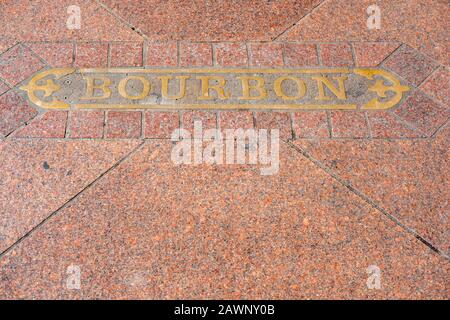 Sidewalk street sign, street name, Bourbon Street, downtown New Orleans, Louisiana, USA Stock Photo