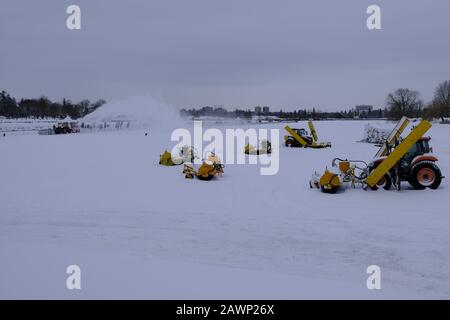 Snow plows clear snow from the skating surface at Dow's Lake, part of the Rideay Canal Skateway, Ottawa, Ontario, Canada. Stock Photo