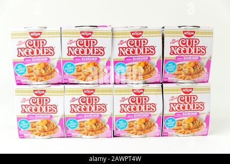 Princeton New Jersey February 9, 2020: Nissin Cup noodle on white background. Selective focus. Instant noodles were invented in 1958 by Momofuku Ando. Stock Photo