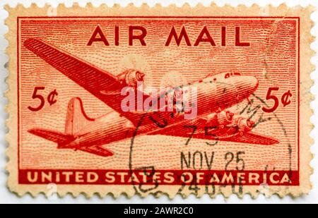 A 1946 US Airmail Postage Stamp featuring a Douglas 'Skymaster' mail airplane. Stock Photo