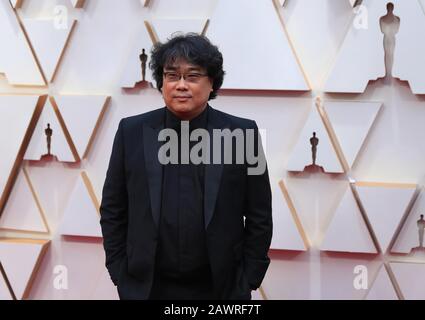 Los Angeles, USA. 9th Feb, 2020. Bong Joon-ho, director of 'Parasite', arrives for the red carpet of the 92nd Academy Awards at the Dolby Theatre in Los Angeles, the United States, Feb. 9, 2020. Credit: Li Ying/Xinhua/Alamy Live News Stock Photo