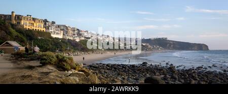 Panorama of Strands Beach on the Pacific Ocean with luxury homes and a public beach in Dana Point, California Stock Photo