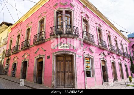 The Rockola bar in the pink Hotel Jardin on the Plaza de la Constitucion in Angangueo, Michoacan, Mexico. Angangueo is a tiny, remote mountain town and the entry point to the Sierra Chincua Monarch Butterfly Sanctuary. Stock Photo