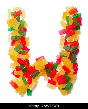 Letter W of the English alphabet  from multi-colored chewing marmalade on a white isolated background. Food pattern made ffrom children's sweets bears Stock Photo
