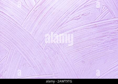 A close-up texture background of a distressed relief light bright purple wall painted with wide strokes Stock Photo