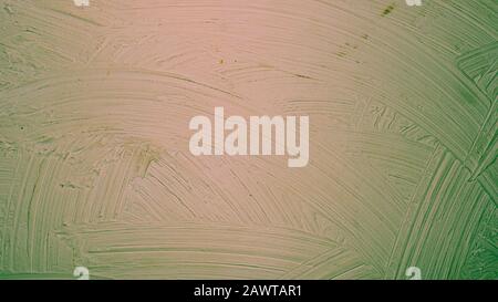 A close-up texture background of a distressed relief green red orange wall painted with wide strokes Stock Photo