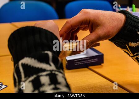 Puget-Théniers, France - February 5, 2020: A close-up shot of a man's hands while he's playing Kapla Stock Photo