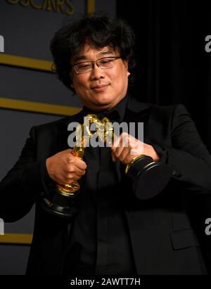 Bong Joon-ho with his Oscars for Best Director and Best Picture for Parasite in the press room at the 92nd Academy Awards held at the Dolby Theatre in Hollywood, Los Angeles, USA. Stock Photo