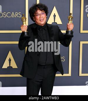 HOLLYWOOD, CA - FEBRUARY 9: Bong Joon-ho poses in the press room during the 92nd Annual Academy Awards at Loews Hollywood Hotel on February 9, 2020 in Hollywood, California. Photo: Christopher Victorio/imageSPACE/MediaPunch Stock Photo