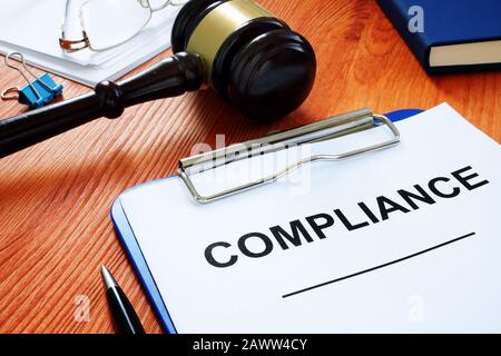 Compliance form and gavel in the court. Stock Photo