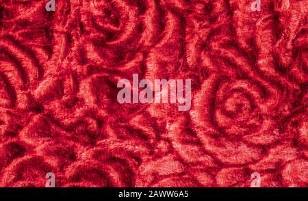 Red knitted texture abstract roses pattern. Valentines day background. Stock Photo