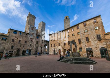 SAN GIMIGNANO, ITALY - FEBRUARY 8, 2020: View of Piazza della Cisterna in the medieval town of San Gimignano, Tuscany, Italy Stock Photo