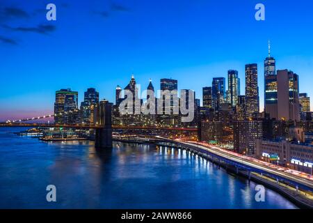 Brooklyn Bridge in Manhattan downtown with Cityscape at night New York USA Stock Photo