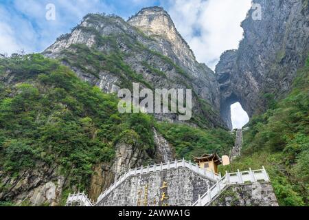 The Heaven's Gate of Tianmen Mountain National Park with 999 step stairway on a cloudy day with blue sky, Zhangjiajie, Changsha, Hunan, China Stock Photo