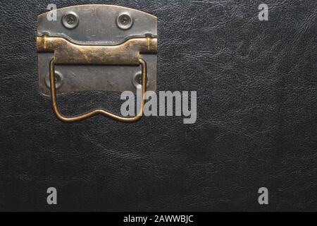 Metal handle with black leather background Stock Photo