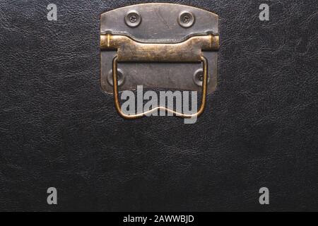 Metal handle with black leather background Stock Photo