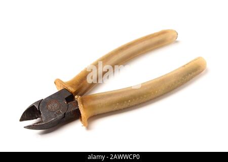 Old working nippers with dilettronic handles isolated on white background Stock Photo