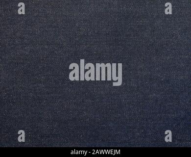 Dark indigo washed denim fabric texture swatch Stock Photo