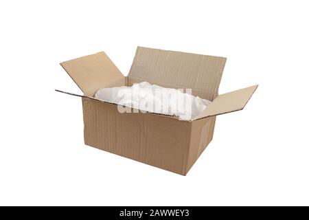 Opened cardboard box with crumpled wrapping paper. Shipment package.  Isolated on white. Stock Photo