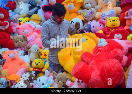 A man is making teddy bears on his shop in Kolkata, India. Stock Photo