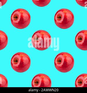 Seamless pattern of fresh red apples on blue background isolated, bright shiny apple repeating ornament, tasty juicy ripe fruits backdrop, wallpaper Stock Photo