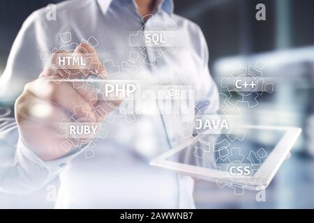 Web development tools concept on virtual screen. Programming language and scripts. PHP, SQL, HTML, Java and others Stock Photo