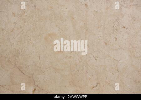 Fresh marble texture in beige hue close-up. Stock Photo