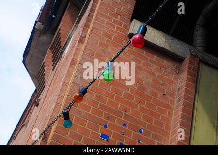 Colored light bulbs on the chain in front of a club in Berlin Stock Photo