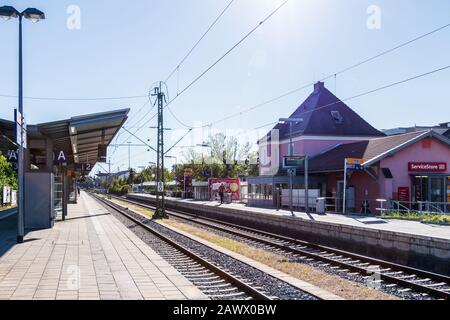 Municipal Germering, District Fürstenfeldbruck, Upper Bavaria, Germany: Panorama of Platform, Main Station and Buildings Stock Photo