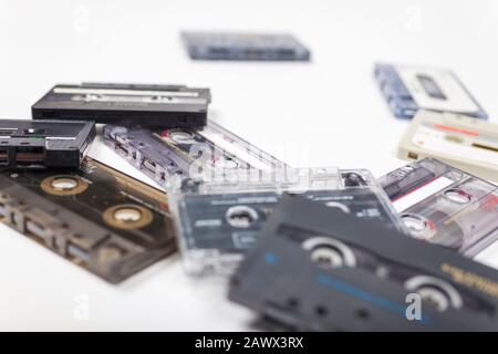 Pile of compact audio cassette tapes on a white background Stock Photo