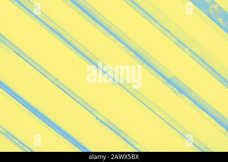 Yellow background with diagonal blue frayed stripes Stock Photo