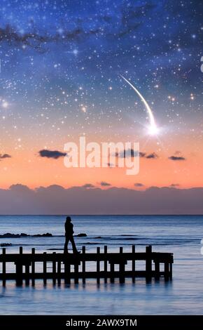 Fantasy landscape eBook cover template - silhouette of a woman walking on pier admiring stars in the sky. Elements of this image are furnished by NASA Stock Photo