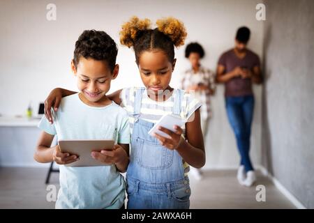 Family sharing there privacy data by using digital devices, phones, tablets Stock Photo